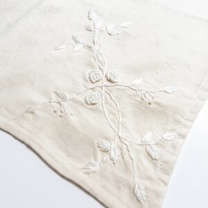 4. The Kala Cotton Twill Botanical Napkin – Hand-Embroidered White-on-White Floral Motif