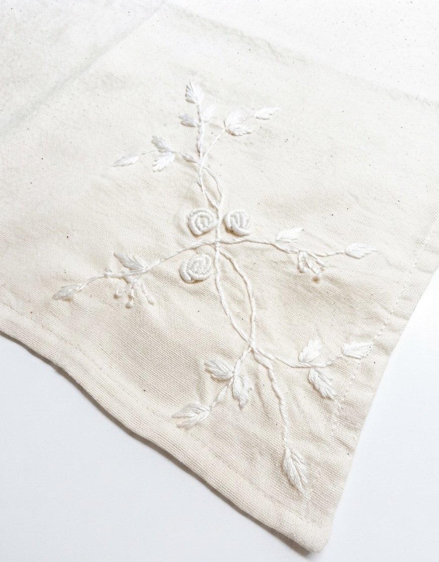 4. The Kala Cotton Twill Botanical Napkin – Hand-Embroidered White-on-White Floral Motif