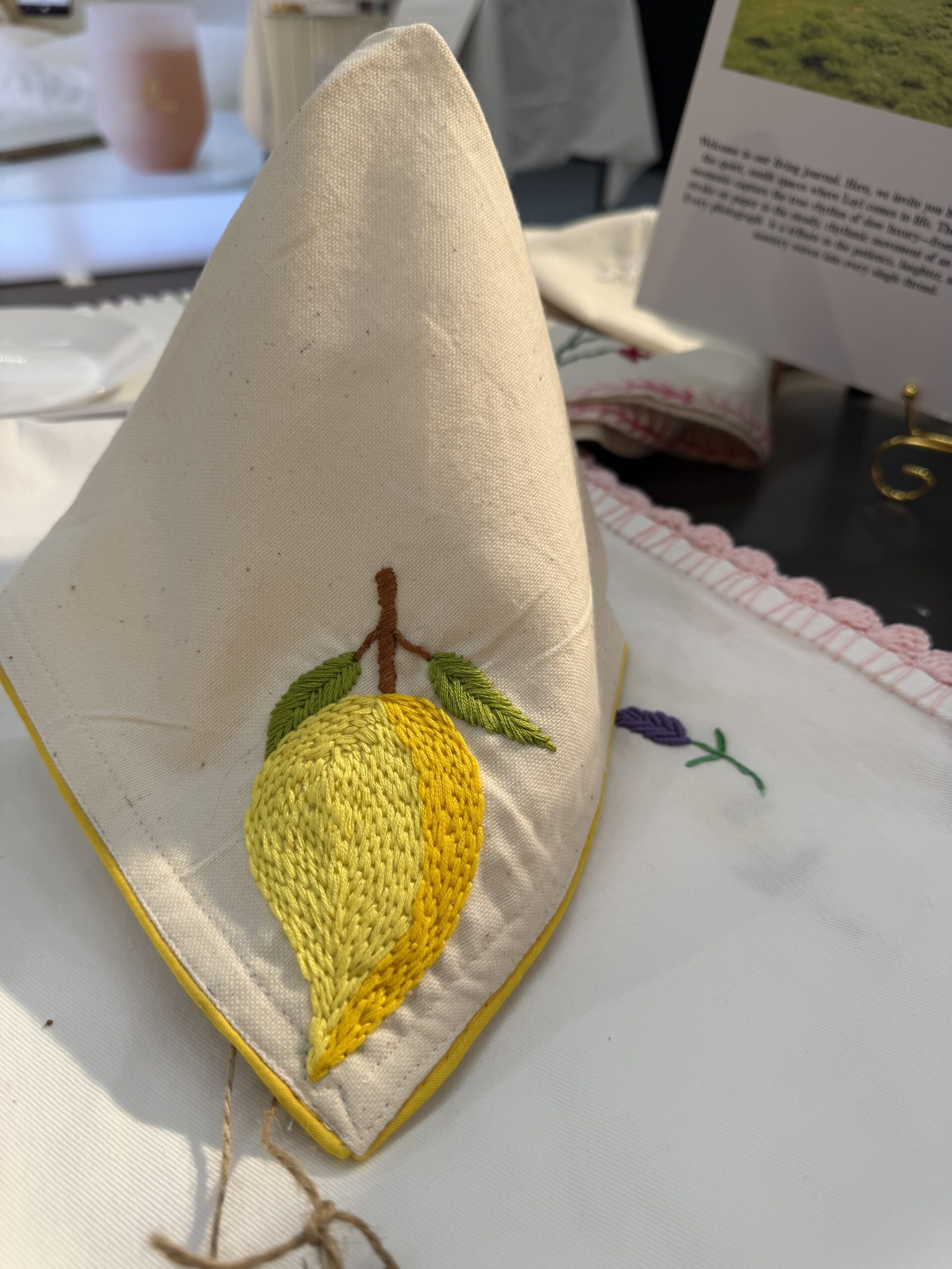 The Kala Cotton Twill Mango Napkin – Hand-Embroidered Mango Motif with Yellow Border