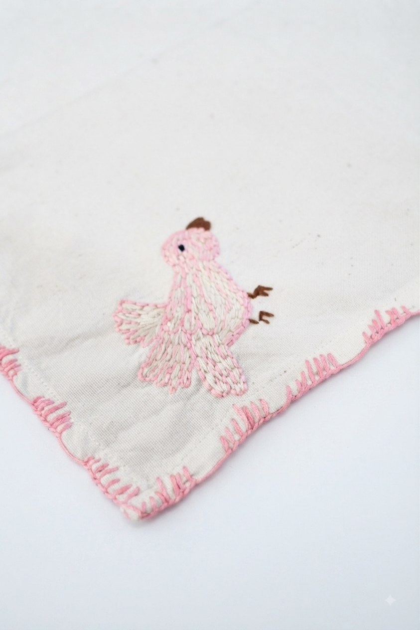 3. The Kala Cotton Twill Songbird Napkin – Hand-Embroidered Bird Motif with Pink Border - Image 2